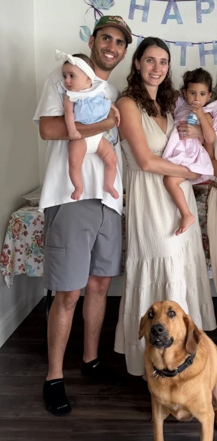 Mark Bibas with his wife, two daughters, and family dog